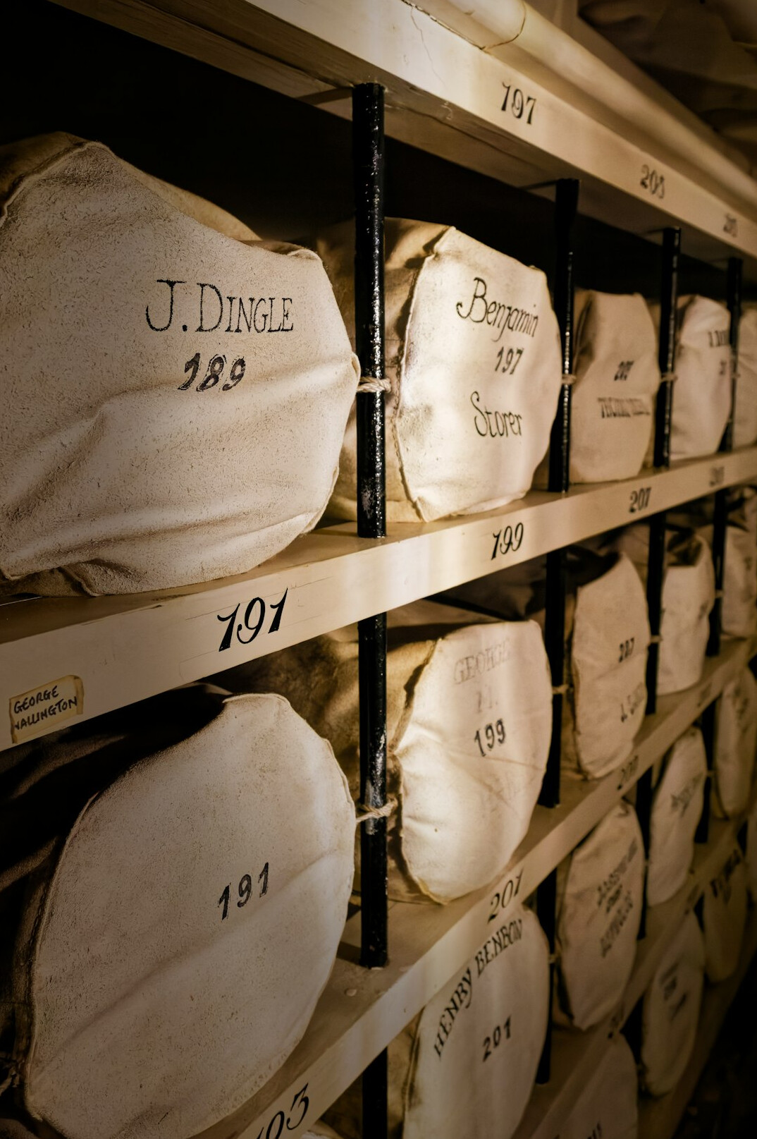 Archive room with tall shelves of boxed documents and files